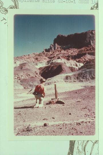 Dock Marston examines a claim stake in cayons at mile 147-148, left bank