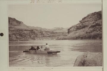 Pilgrimage to a Shrine--Hole-in-the-Rock. The horse pilgrims from Bluff cross the river to Hole-in-the-Rock after riding out over old trail from Bluff. Up river to Jackass Bench at left