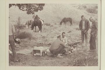 Breakfast at base camp north of 73.6. Bill Belknap and Tom Daly are the chefs. Chris Turner and Archeyes Masland are the hungry customers
