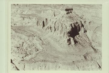 Arch in the Sky; Octagon Butte; Cummings Mesa. Navajo Reservation. This view shows the opening back of the arch