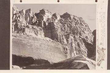 Eddy sign 70 ft. above river. Mile 203.2 right bank. Bud Rusho in foreground