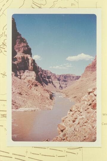Up Cataract Canyon from Mile 203.1. The island at Mile 203 breaks the water at lower left margin. Rapid No. 19 is in the middle distance--Mile 203.7 and dropping 6 ft. in 0.2 miles. This is Stanton's Hells Half Mile. Compare Reilly photo 9 5 60
