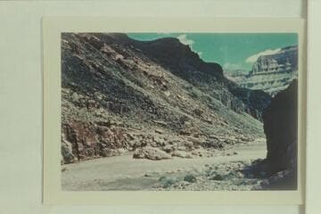 The bedrock in Bedrock Rapid. The Hatch-Dines party looked over the rapid about ten minutes before running it. The pontoon hit the point of the bedrock and stayed there