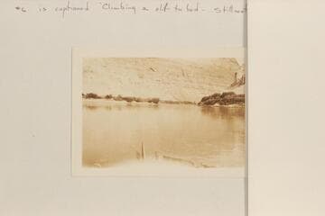 "Junction of the Green River and the Colorado." Sent by Adolph G. Sutro. It is captioned, "Climbing a cliff to bed--Stillwater Canyon." The view is from Cataract Canyon back toward the junction and is similar to McCormick photo #15, 1901-1902