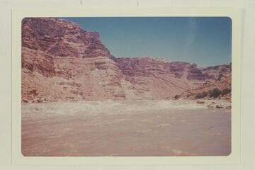 Up river at the foot of the rapid below the mouth of Range Canyon. Approximately Mile 204.65
