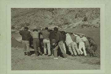 The "Emma Dean" being rolled for attaching a cable. Above Moab and below Castle Creek. Filming of "The Colorado River Story" by Disney