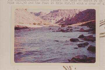 Upstream from Mile 212.0 in Cataract Canyon. Note upturned beds flanking gypsum plug at Red Lake Canyon. The Chenowith-Hoyt table places the head of Rapid #1 at Mile 212.30 and the foot at Mile 212.15 with a drop of 4 ft