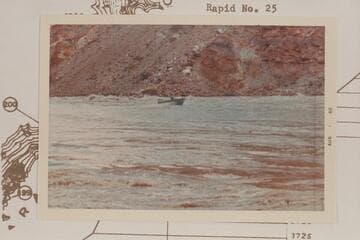 Harris-Brennan boat out of the lower end of Rapid 22. The Sliced Boulder appears back of boat