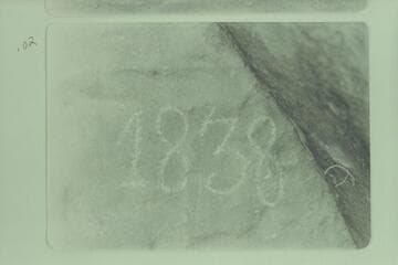 The D I 1838 inscription at Mile 221-222 at head of Whirlpool Canyon. Photo after Glade Ross had gone over the lines with a soft rock. He "noticed the inscription was put in with what appeared to be a dull center punch."