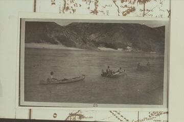 Motorboat towing the "Tapeats" and the canoe at Middle Black Canyon Damsite. Probably a LaRue photo during the cruise from Pierce Ferry to Needles