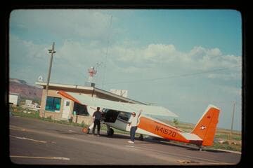 Ron Smith's plane at the Kanab Airport. Art Gallenson at left; John Hoffman at right