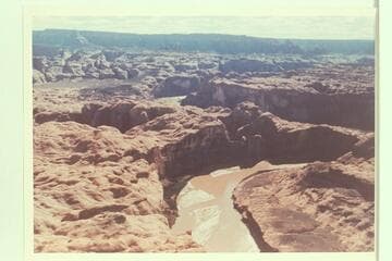 Down Glen Canyon to mouth of 73.6. The mouth of 71.25 is beyond at the cactus flat