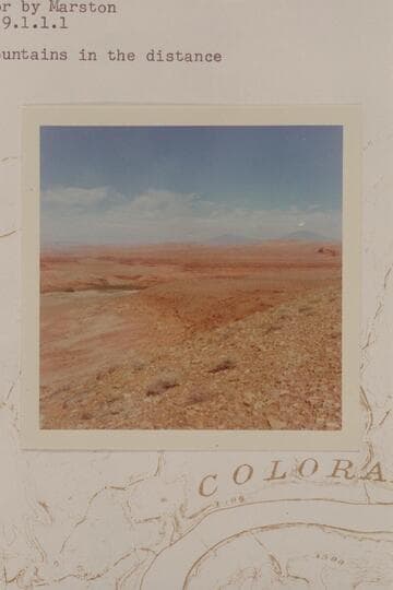 Dugway at left bank of Halls Crossing. Henry Mountains in the distance