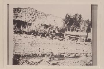 Stuck in the sand just below Lees Ferry. 10 yoke of cattle hauling the boiler