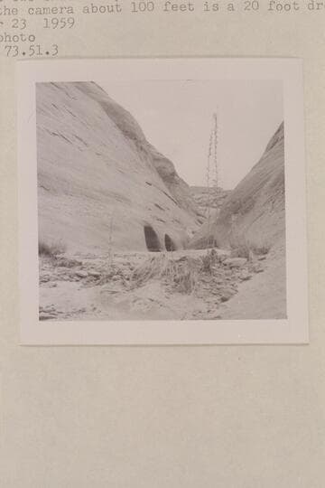 Up the water course of the southwest fork of 73. There are two small drops just beyond the holes in the wall. Back of the camera about 100 ft. is a 20-ft. drop