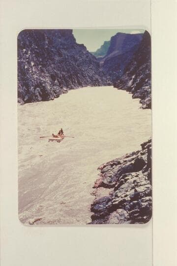 A. K. Reynolds running Sockdologer Rapid. The photographer is on the left bank near the lower end of the rapid. Ellen Reynolds is riding the stern with Cappy Rowe in the bow. Bright Angel gauge: 15,000 cfs