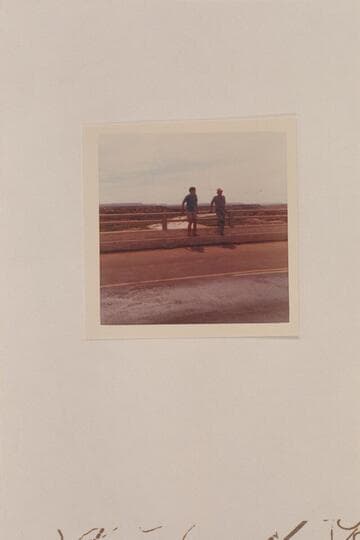 Nate and Jim Jordan at the rail of the new highway bridge at Cameron. The Little Colorado is running mud