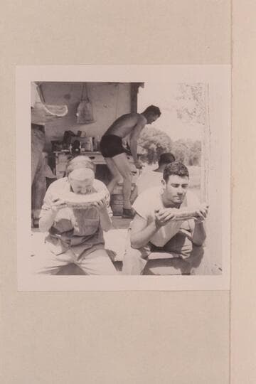 Shirley and Garth Marston eat melons. Island Park; Ruple Ranch