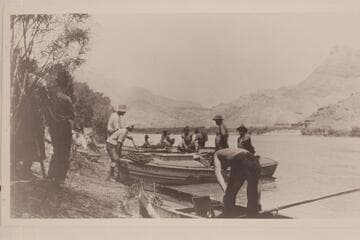 USGS preparing to leave Lees Ferry in 1923. The boatman with the chest at waistline is Lewis R. Freeman