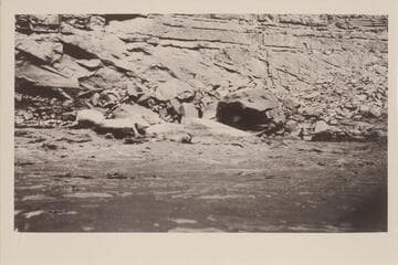 The "Boulder" in Rapid No. 4, Mile 16.7. Leigh B. Lint, boatman. R. C. Moore, passenger