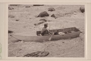 Lorin Bell in Government Rapid, San Juan River. 15-ft. folding boat of the Monument Valley-Rainbow Bridge Expedition borrowed by Nevills. Flow of the river approximates 400 cfs