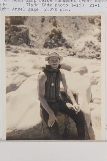 Frank Swain at noon camp below Monument Creek Rapid. Frank filled with water and, at bottom of rapid, capsized (Eddy notes). Bright Angel gauge: 2,070 cfs
