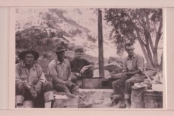 Camp at Rapid #37. 21.7 miles below mouth of Green River, 8:20 AM. Identification by Leigh Lint: Harry Tasker; Lint; Stoudt; and Clogston, members of the Chenoweth party surveying Cataract Canyon