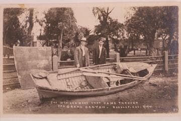 Charles Russell and Ed Monett with the steel boat "Utah" at the end of the trip. The trip started from Greenriver, Utah, in 1907. The sheet metal at left is the cover for the after section of the boat