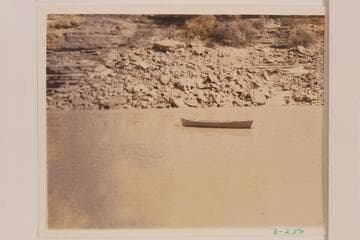 The boat abandoned at camp at Mile 177.7 left bank. Dusty Dozen cruise