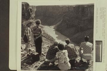 On the rim above Badger Creek Rapid watching Georgie White put her neoprene raft through the rapid. Rosalind Johnson at the left