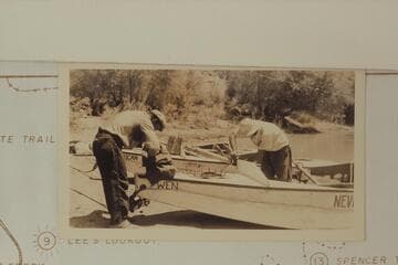 Del Reed and Norm Nevills repairing the "Wen." Note the hatch fastenings. Print sent by Barry Goldwater