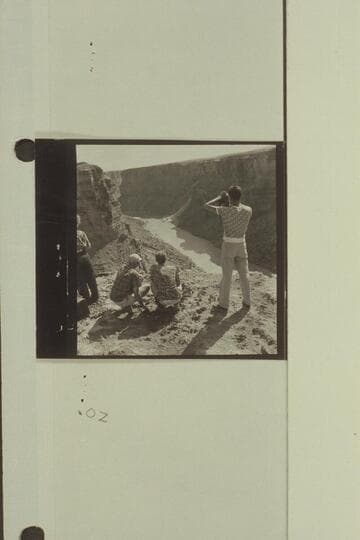 Watching Georgie White and Elgin Pierce at Badger Creek Rapid. Raft at head of rapid