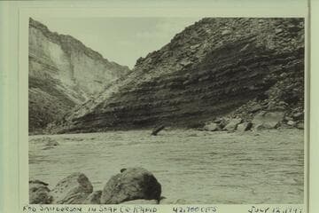 Rod Sanderson wioth outboard motorboat in Soap Creek Rapid
