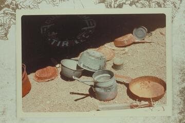 Pans and utensils in lower level of the "Houserock" at the Bass Mine in Hakatai Canyon