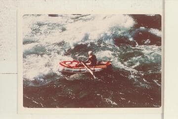 Run of Sockdologer Rapid in small inflated craft. Ed Herrman; Howard Booth; Jorgen Visbak