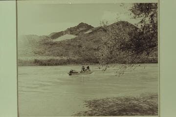 The "Esmeralda" starts down the Canyon in 1949. Lees Ferry. Left to right: Robinsln; Taylor; Hudson; Marston; Edward Hudson is back of his dad. National Park Service photo