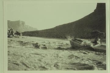 Bert Loper in rapid near McPherson Ranch. Probably Mile 40. McPherson Ranch is Mile 39.4 left bank. The maps show a rapid below at Florence Creek, Mile 38.8