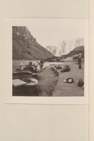 The three boats moored at camp near Mile 210. Joe and Rod work at the lines while Hugh looks on