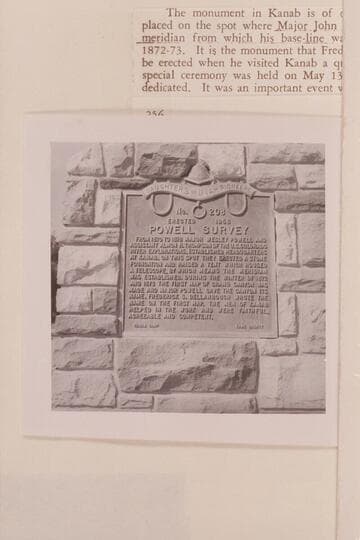 Plaque on monument with reference stone. Old tithing lot at Kanab