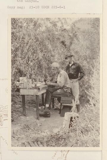 Office work at Diamond Creek. Col. Claude H. Birdseye and his cousin Roger Birdseye