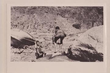 Bill Adger comes ashore from efforts to salvage the "Powell" which became locked in the rocks of Dubendorff Rapid on 1927, July 27. The operation was abandoned July 31