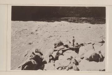 "Boulder" and "Glen" after portage of Lava Cliff Rapids. Felix Koms (cook) on boat