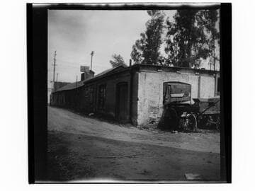 Alley and wooden wagon near 225 San Pedro Street, Los Angeles