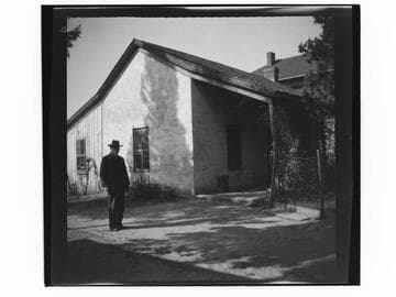 Man in front of house
