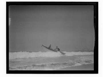 Coach and instructor taking a lifeboat out on the water for lifeguard training, Santa Monica