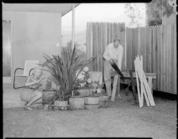 Man & woman at home working around house