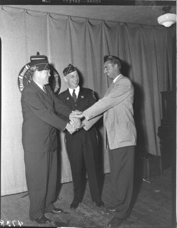 Three American Legion members shaking hands