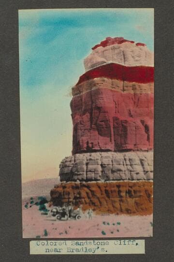 Zahn trip to San Juan placers in a Franklin car. Colored sandstone cliff, near Bradley's