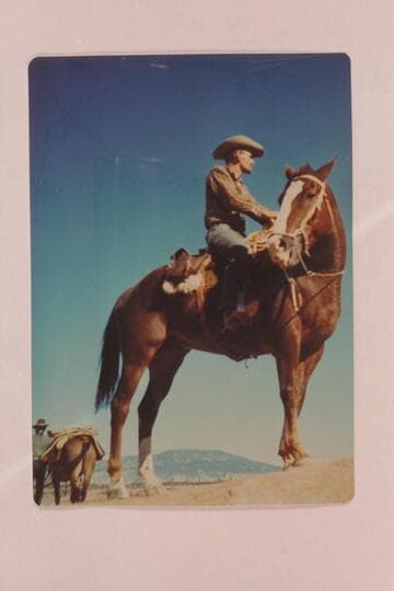 Tom Daly and Chillie Whitehat at left; Navajo Mountain in distance. In edge of Navajo Canyon