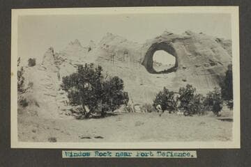 Zahn trip to San Juan placers in a Franklin car. Window Rock near Fort Defiance